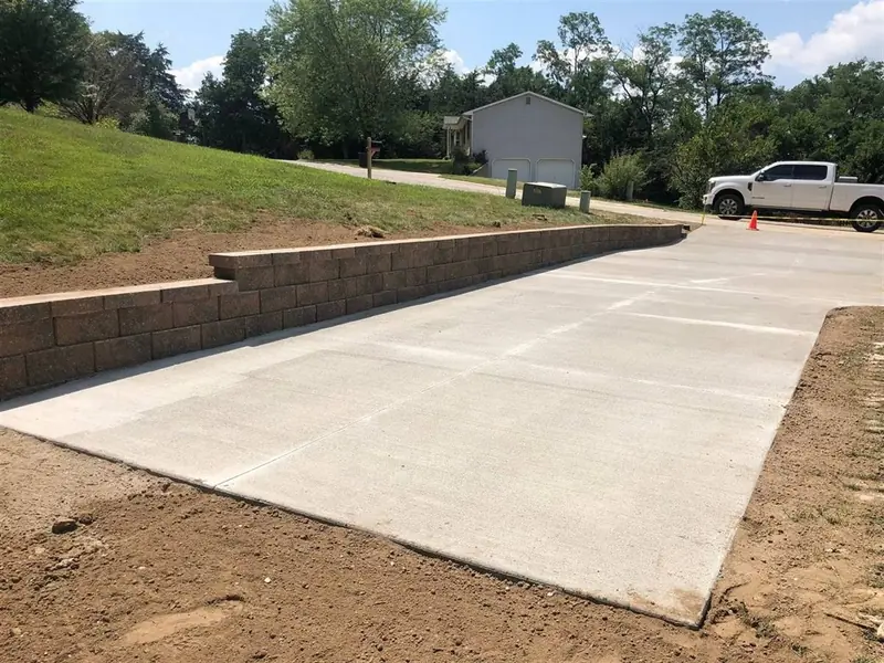 New concrete driveway with retaining wall in Rolla, MO